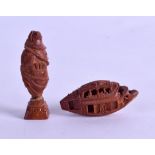 TWO EARLY 20TH CENTURY CHINESE CARVED NUTS one in the form of a boat, the other a standing