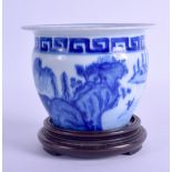 A SMALL CHINESE BLUE AND WHITE PLANTER bearing Kangxi marks to base, painted with landscapes. 10.5