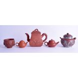 A CHINESE QING DYNASTY YIXING POTTERY TEAPOT AND COVER together with two small plain yixing teapots,