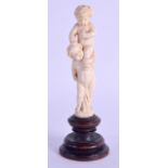 A 19TH CENTURY EUROPEAN CARVED IVORY FIGURE OF TWO BOYS modelled upon each others backs. Ivory 7.