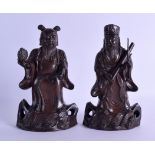 A PAIR OF 17TH/18TH CENTURY CHINESE BRONZE FIGURES OF IMMORTALS modelled standing upon open work