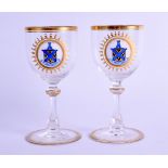 A PAIR OF EARLY 20TH CENTURY BOHEMIAN GLASSES enamelled with the family crest of the MacCallum Clan.