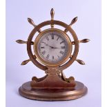 AN EARLY 20TH CENTURY HOWELL JAMES & CO SHIPS WHEEL MANTEL CLOCK with silvered dial. 18 cm x 20 cm.