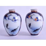 A PAIR OF LATE 19TH CENTURY JAPANESE MEIJI PERIOD PORCELAIN VASES painted with fish swimming. 7.5 cm