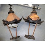 A LARGE PAIR OF COPPER & IRON LAMP POST HEADS.