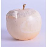 A GOOD 19TH CENTURY JAPANESE MEIJI PERIOD CARVED IVORY APPLE naturalistically modelled half