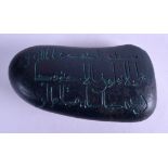 AN UNUSUAL ISLAMIC CALLIGRAPHY CARVED BLACK STONE. 13.5 cm x 8 cm.