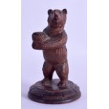 A LATE 19TH CENTURY GERMAN BLACK FOREST BAVARIAN PEN HOLDER in the form of a standing bear. 13 cm