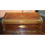 AN ANTIQUE WOODEN WRITING BOX, with applied brass decoration. 50 cm wide.