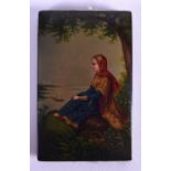A 19TH CENTURY RUSSIAN PAPIER MACHE LACQUERED NOTE BOOK painted with a female seated within a