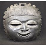 AN ANTIQUE CARVED WOODEN MASK. 29 cm x 27 cm.