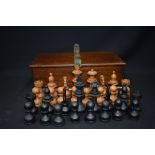 AN ANTIQUE BOXED CHESS SET, in a sectional box. King height 11 cm.