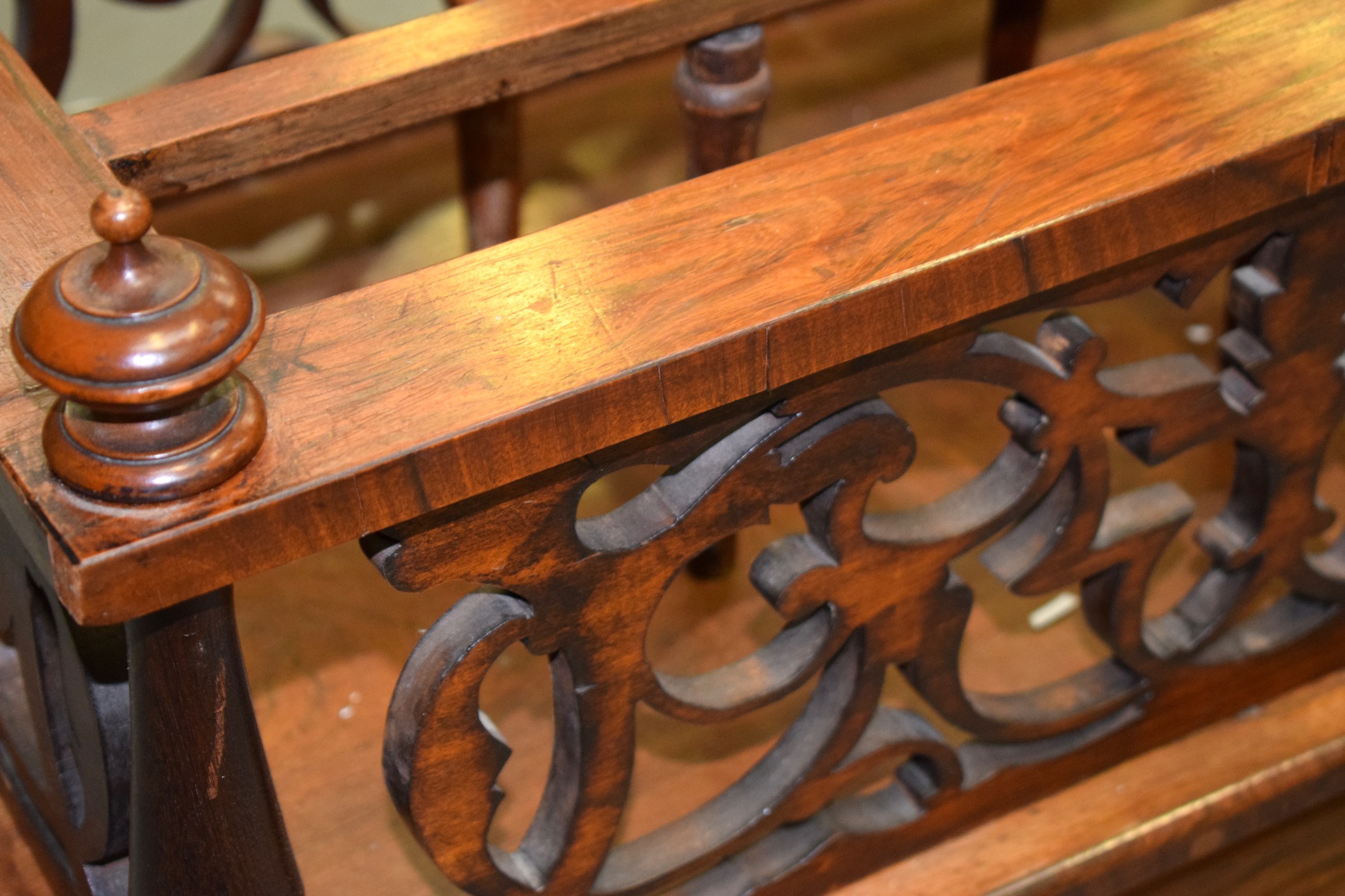 A VICTORIAN FIGURED WALNUT CANTERBURY, with carved fretwork and turned upright supports. 64 cm - Image 2 of 3