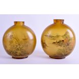 A LARGE PAIR OF CHINESE QING DYNASTY REVERSE PAINTED AMBER GLASS SNUFF BOTTLES decorated with birds