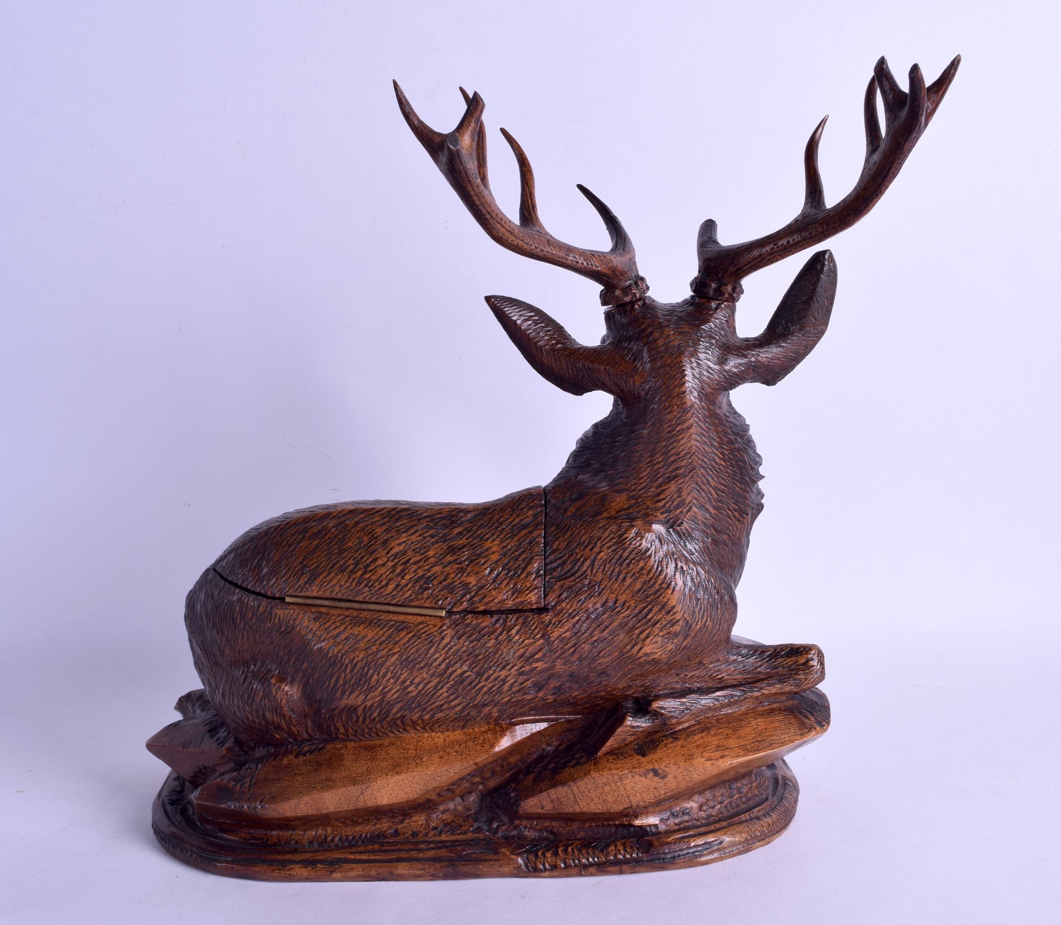 A FINE 19TH CENTURY BAVARIAN BLACK FOREST CARVED WOOD INKWELL in the form of a seated stag upon a - Image 2 of 3