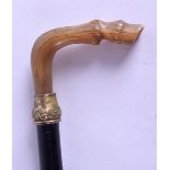 A LATE 19TH CENTURY CARVED RHINOCEROS HORN WALKING CANE in the form of a horses hoof. 89 cm long.