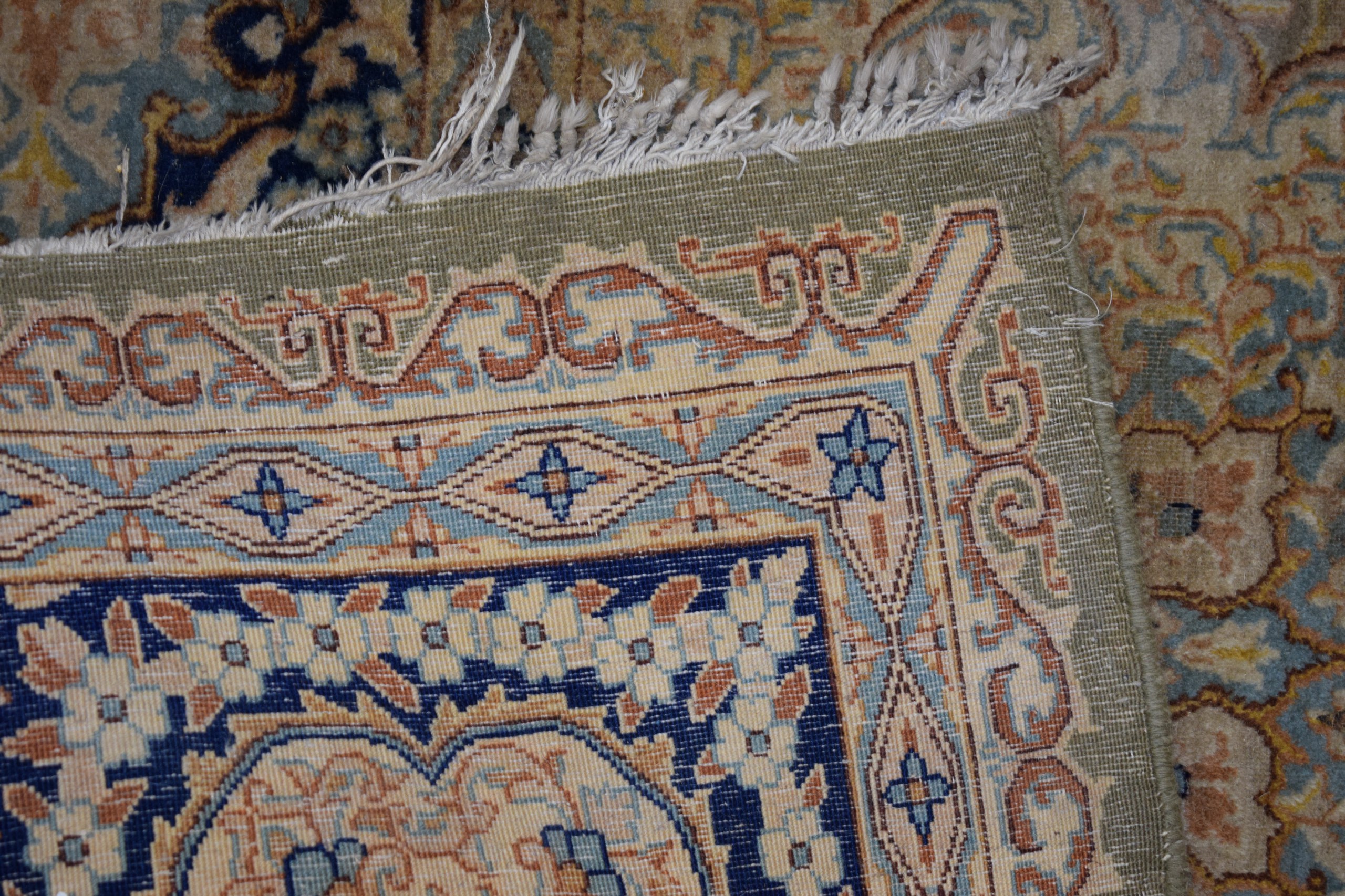 A VERY LARGE GREEN GROUND PART SILK CARPET decorated with motifs. - Image 4 of 4