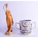 A ROYAL WORCESTER BLUSH IVORY FIGURE OF A FEMALE WATER CARRIER together with a twin handled 'God