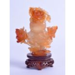 AN EARLY 20TH CENTURY CHINESE CARVED AGATE VASE AND COVER of naturalistic form with overlaid