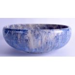 A LARGE ART DECO BLUE DRIP GLAZED POTTERY BOWL in the manner of Ruskin. 30 cm diameter.