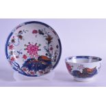 AN 18TH CENTURY CHINESE EXPORT CLOBBERED TEABOWL AND SAUCER Qianlong, painted with floral sprays.