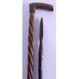 A 19TH CENTURY CARVED HORN HANDLED WALKING CANE together with a tribal wooden staff/spear. 84 cm &