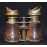 AN ANTIQUE PAIR OF SNAKE SKIN BINOCULARS.