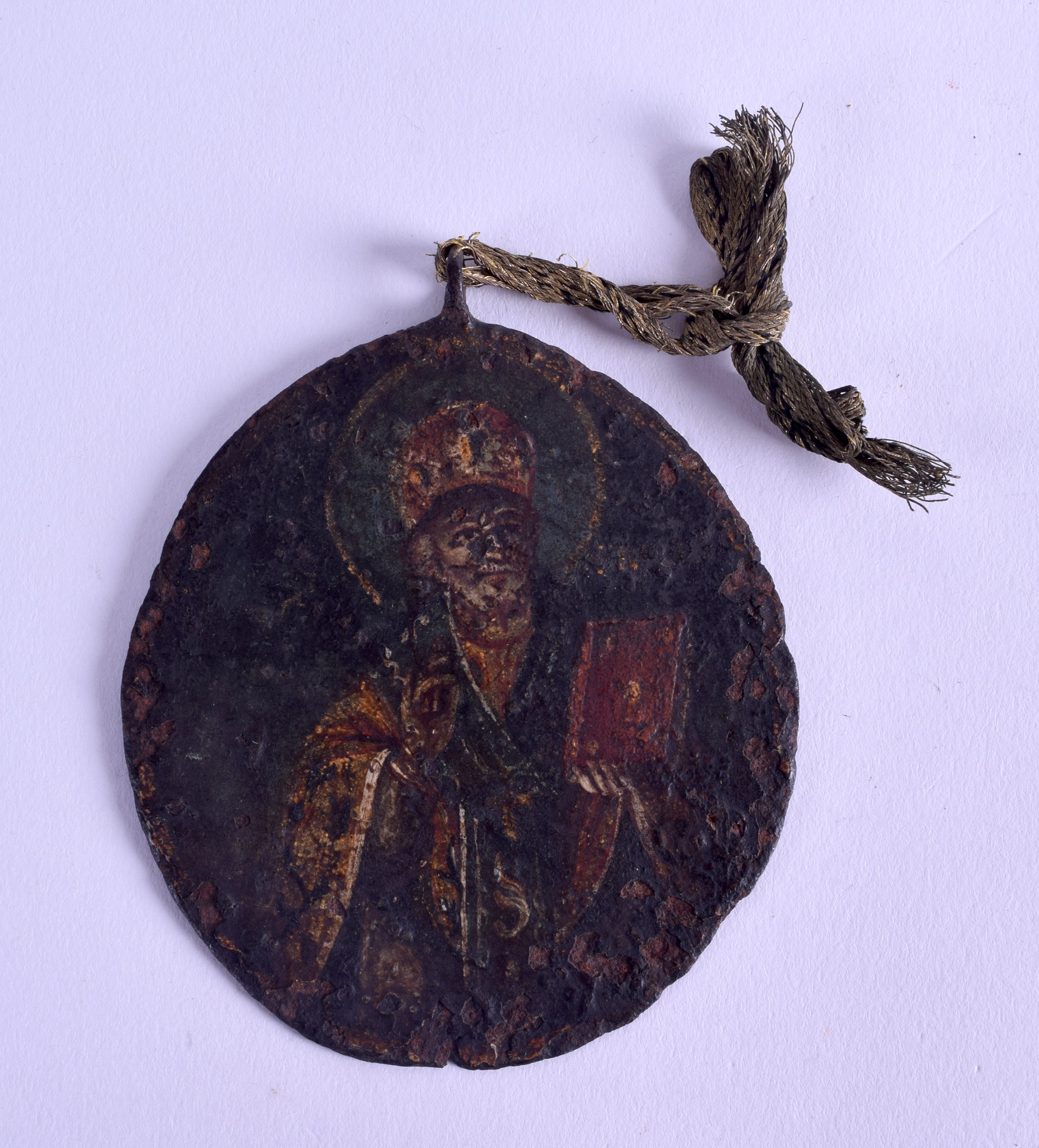 A GOOD 17TH/18TH CENTURY RUSSIAN DOUBLED SIDED TIN ICON depicting a saint on either side. 8 cm x 9. - Image 2 of 2