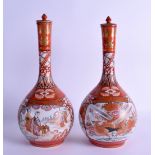 A PAIR OF 19TH CENTURY JAPANESE MEIJI PERIOD KUTANI PORCELAIN VASES AND COVERS painted with birds