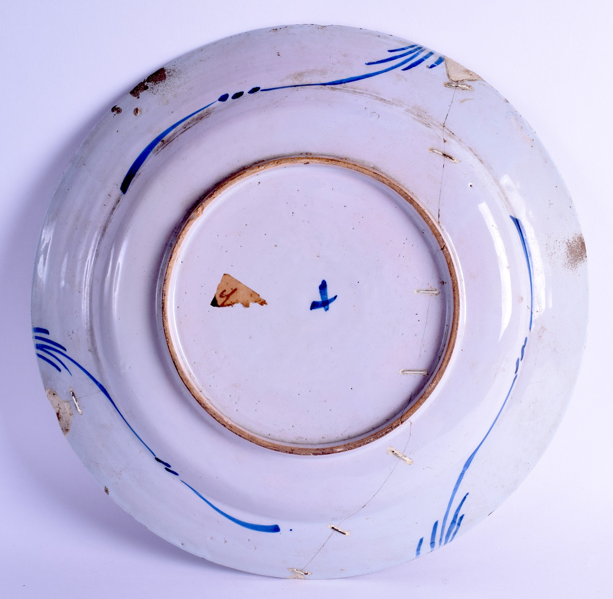 A LARGE 18TH CENTURY DELFT FAIENCE TIN GLAZED CHARGER painted with insects, flowers and hollow rock. - Image 2 of 2