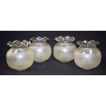 A GROUP OF FOUR ANTIQUE GLASS SHADES, engraved with foliage. (4)