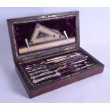 A LOVELY CASED ANTIQUE SCIENTIFIC INSTRUMENT SET with carved ivory mounts, within original box. 25