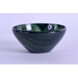 A CHINESE CARVED GREEN MOSS AGATE CIRCULAR TEABOWL. 5.5 cm diameter.