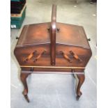 AN ANTIQUE WOODEN SEWING BOX ON STAND, containing multiple sewing reels and vintage buttons. 48 cm