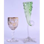 A LATE 19TH CENTURY BOHEMIAN GILT OVERLAID CLEAR GLASS CUP together with a green and clear glass