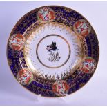 AN EARLY 19TH CENTURY CHAMBERLAINS WORCESTER ARMORIAL BOWL painted with a wild boar under a rich