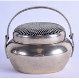 A CHINESE QING DYNASTY POLISHED BRASS HAND WARMER AND COVER with swing handle. 10 cm wide.