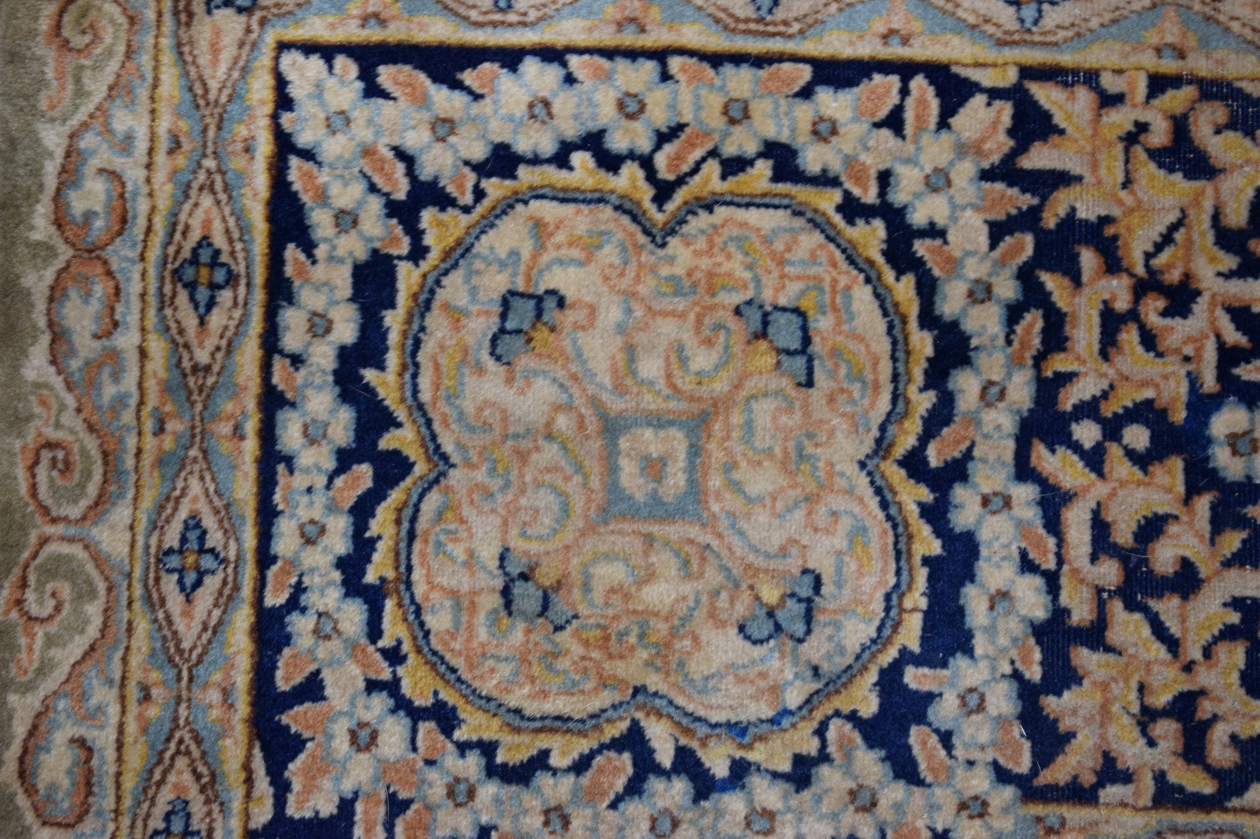 A VERY LARGE GREEN GROUND PART SILK CARPET decorated with motifs. - Image 3 of 4