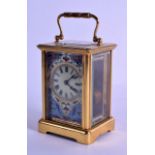 A LATE 19TH/20TH CENTURY FRENCH BRASS CARRIAGE CLOCK with champleve enamel dial, decorated all