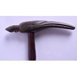 A LATE VICTORIAN/EDWARDIAN CARVED HORN HANDLED WALKING CANE in the form of a stylised bird, engraved