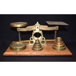 AN ANTIQUE SET OF BRASS SCALES. 24 cm wide.