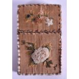 AN UNUSUAL LATE VICTORIAN CARD CASE decorated in relief with floral sprays and vines. 5.5 cm x 9