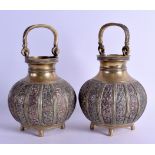 A PAIR OF 19TH CENTURY INDIAN MIXED METAL BRONZE HANGING BOWLS decorated with flowers and vines.