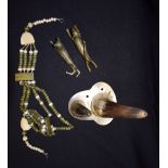 TWO MOUNTED COW HORNS, together with necklace and pair of brass animals. (4)