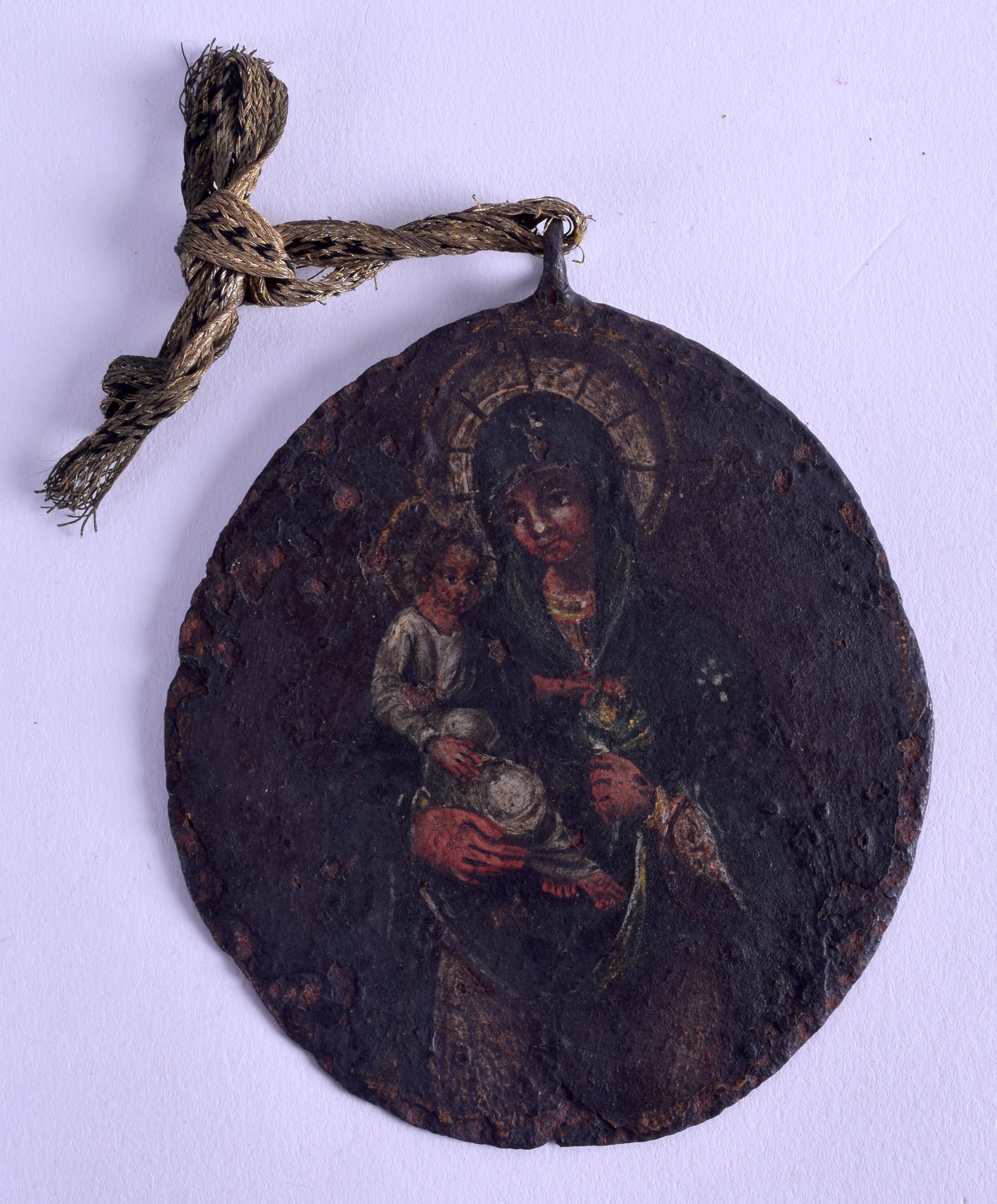 A GOOD 17TH/18TH CENTURY RUSSIAN DOUBLED SIDED TIN ICON depicting a saint on either side. 8 cm x 9.