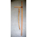 A VINTAGE WOODEN HORSE MEASURING DEVICE, together with a naturalistic wooden staff. 203 cm high.