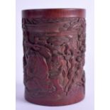 A FINE 19TH CENTURY CHINESE CARVED BAMBOO BITONG BRUSH POT decorated with a seated scholar amongst