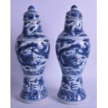 A GOOD PAIR OF CHINESE QING DYNASTY BLUE AND WHITE BALUSTER VASES AND COVERS possibly from a