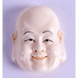 AN EARLY 20TH CENTURY JAPANESE MEIJI PERIOD CARVED IVORY NOH MASK/NETSUKE in the form of a jovial