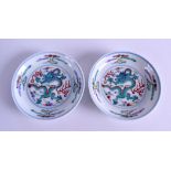 A PAIR OF CHINESE DOUCAI PORCELAIN DISHES bearing Yongzheng marks to base, painted with dragons.